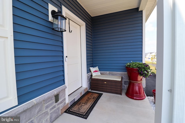 doorway to property featuring covered porch