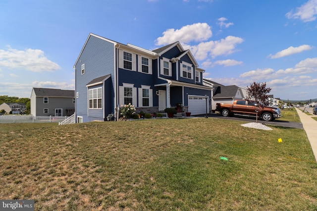 view of front of property with a garage and a front yard