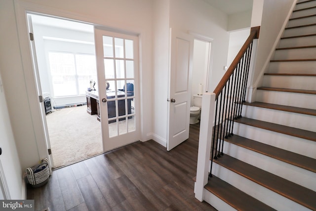 stairs with wood-type flooring