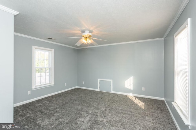 carpeted spare room with ornamental molding, a textured ceiling, and ceiling fan