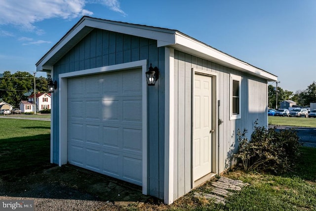 garage with a lawn