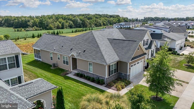 birds eye view of property with a residential view