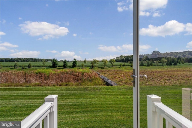 view of yard with a rural view