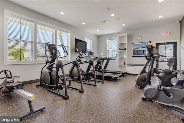 exercise room featuring recessed lighting and baseboards