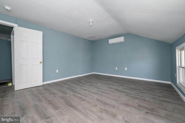 bonus room featuring hardwood / wood-style floors and vaulted ceiling