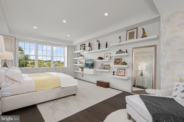 bedroom with dark hardwood / wood-style flooring