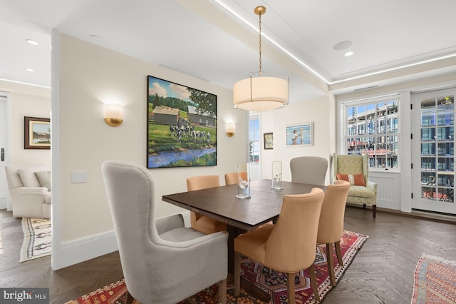 dining room featuring dark parquet floors