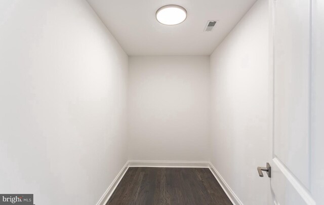 spare room featuring dark hardwood / wood-style floors