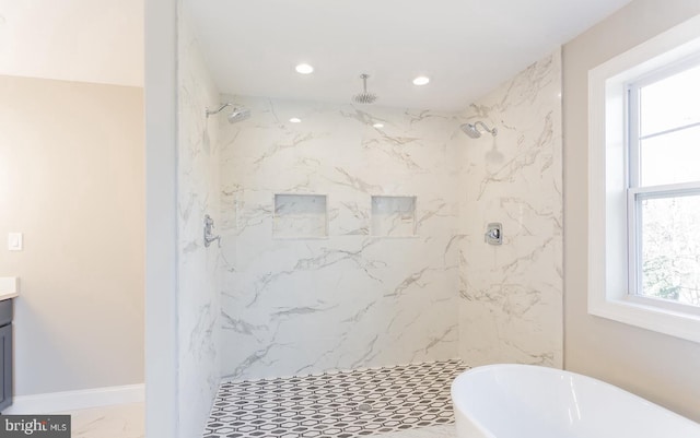 bathroom with vanity and separate shower and tub