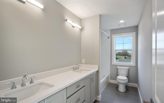 full bathroom with shower / tub combination, vanity, and toilet