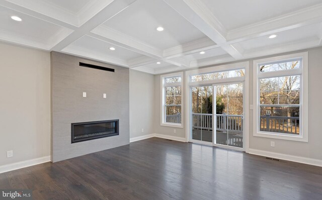 unfurnished living room featuring coffered ceiling, beam ceiling, dark hardwood / wood-style flooring, and a tile fireplace