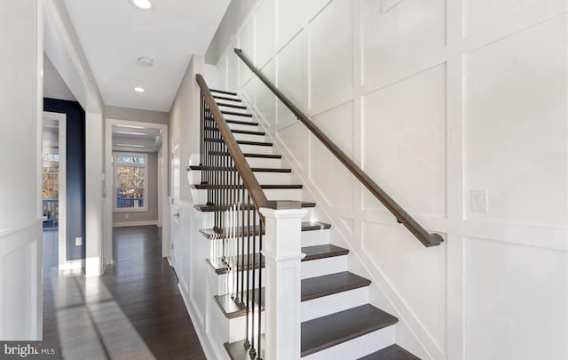 stairs with hardwood / wood-style floors