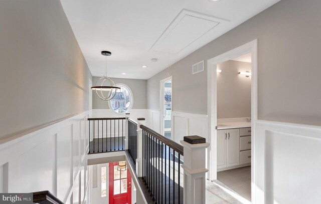 hallway featuring light tile patterned flooring