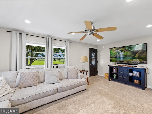 living room featuring ceiling fan and light carpet