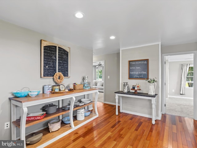 hallway with wood-type flooring