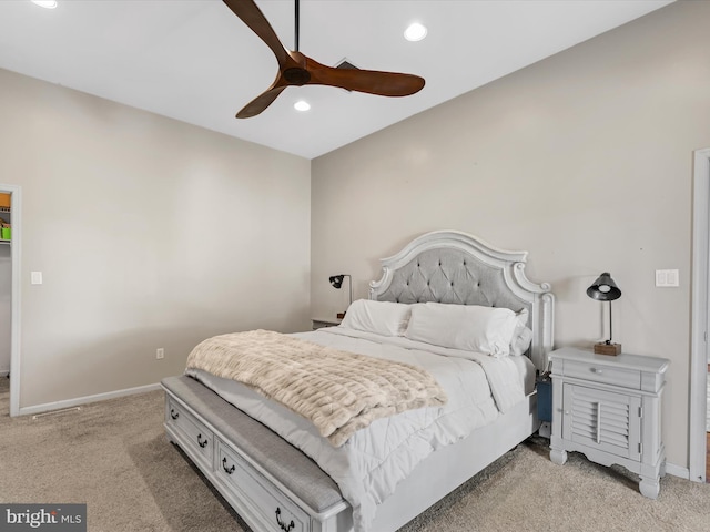 bedroom featuring ceiling fan and light carpet