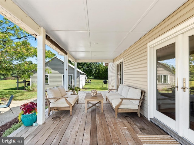 wooden terrace featuring an outdoor hangout area