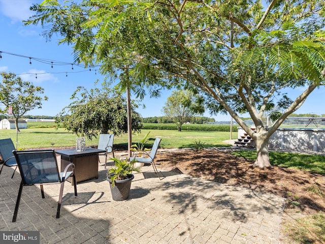 view of patio / terrace with an outdoor fire pit