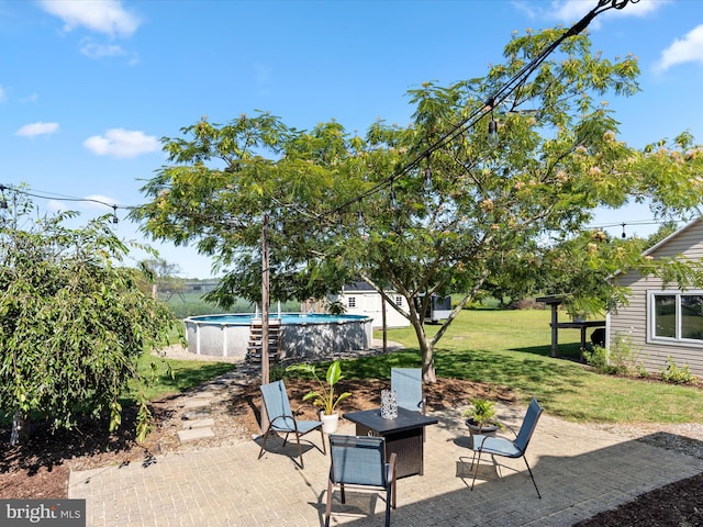 view of patio with an outdoor fire pit