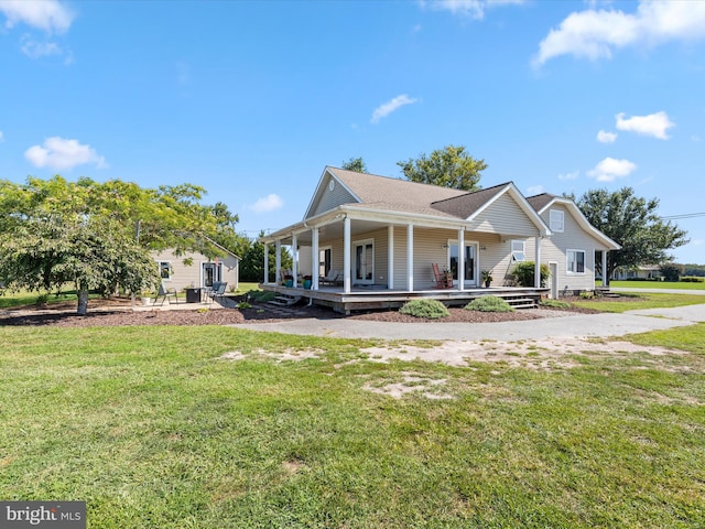 back of house with a yard and a porch