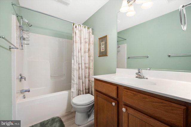 bathroom with vanity, toilet, and shower / tub combo with curtain