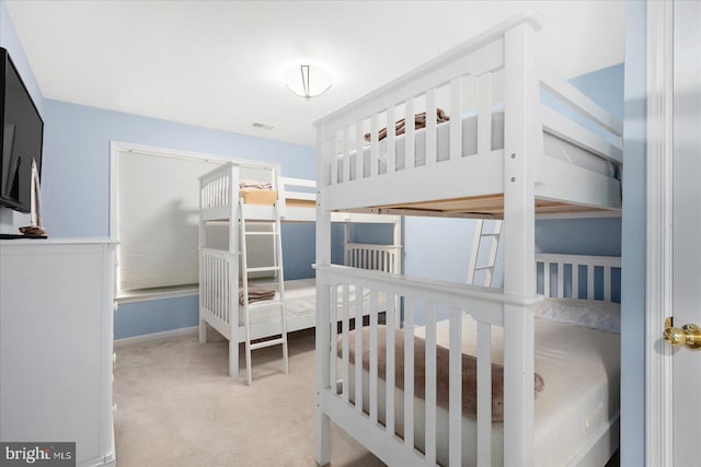 carpeted bedroom with visible vents