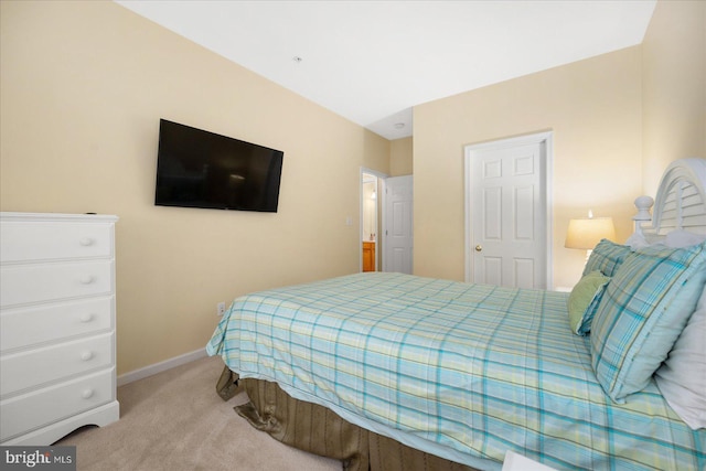 carpeted bedroom featuring baseboards