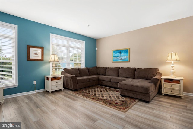 living room featuring light wood-style floors and baseboards