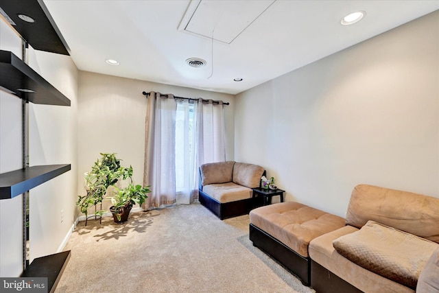 carpeted living room with visible vents, recessed lighting, attic access, and baseboards