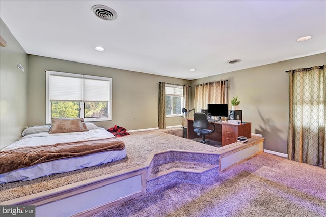 carpeted bedroom featuring visible vents, recessed lighting, and baseboards