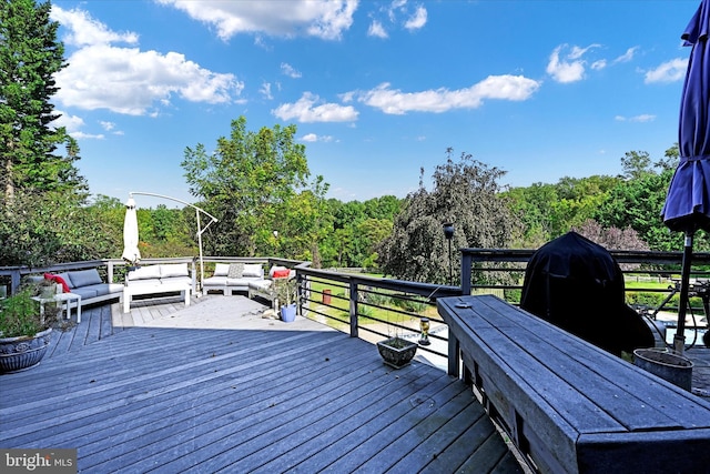 wooden terrace with outdoor lounge area