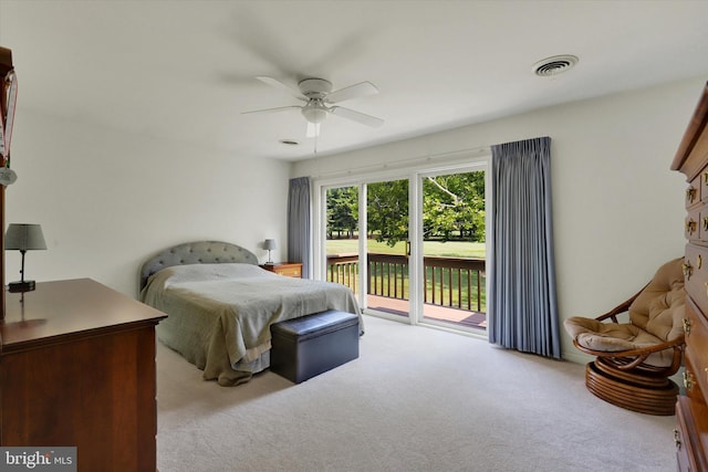 bedroom with light colored carpet, ceiling fan, and access to outside