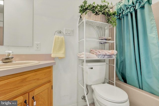 full bathroom with vanity, toilet, and shower / tub combo