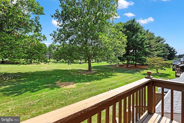 wooden deck with a yard