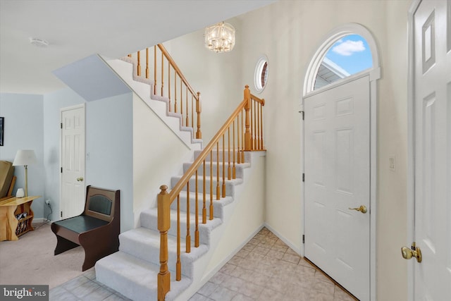 foyer with an inviting chandelier