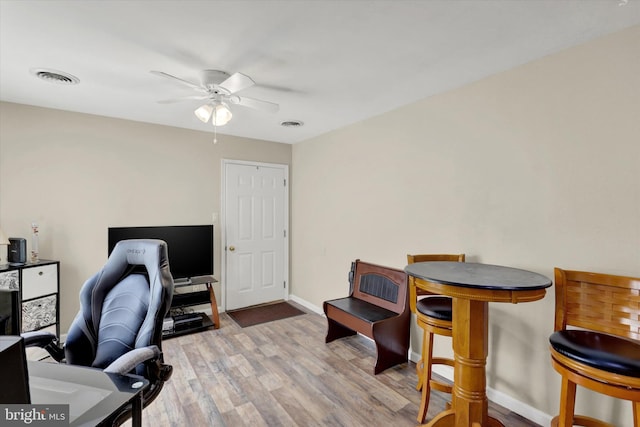 office area with hardwood / wood-style floors and ceiling fan