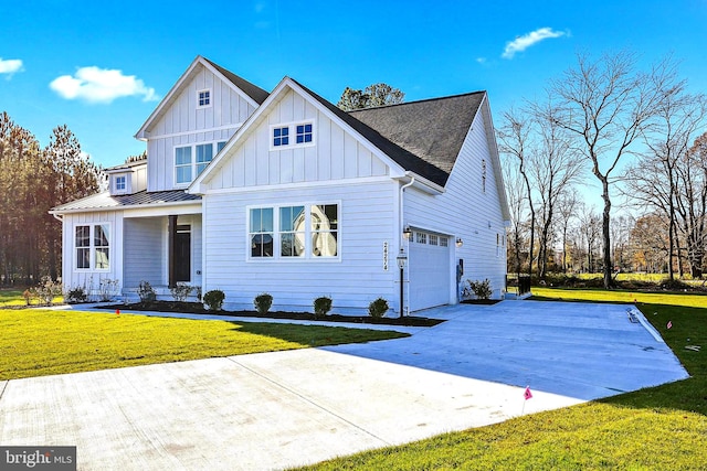 view of front of home featuring a garage and a front lawn