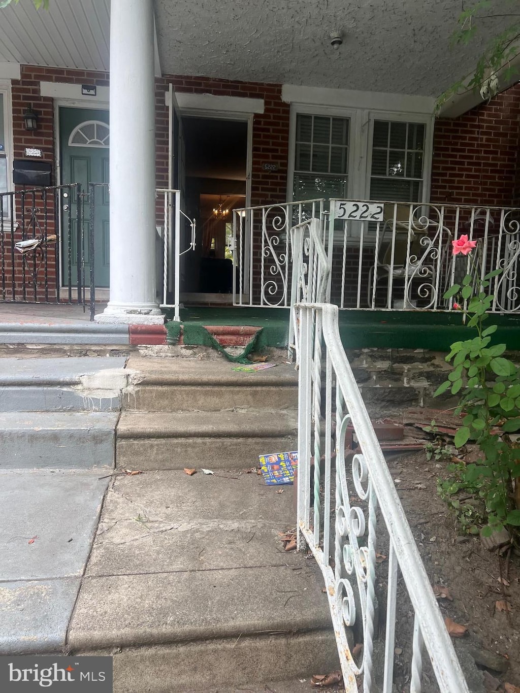 view of exterior entry with covered porch