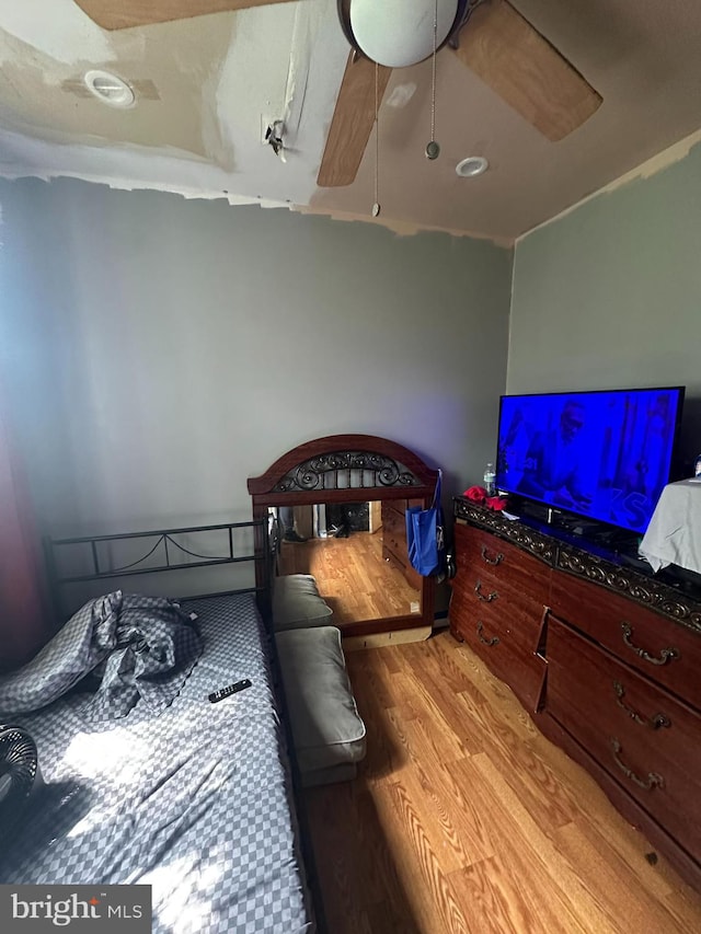 bedroom featuring ceiling fan and wood-type flooring