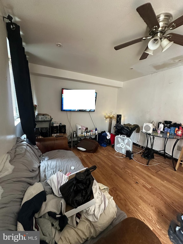 living room with hardwood / wood-style flooring and ceiling fan