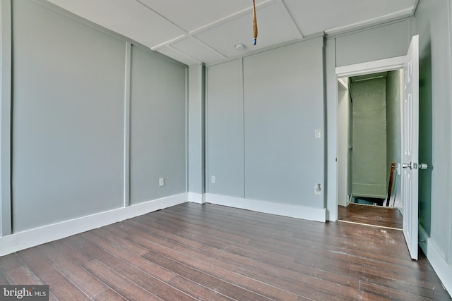 unfurnished room featuring dark hardwood / wood-style floors