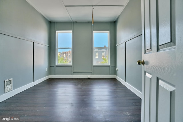 spare room with dark hardwood / wood-style floors