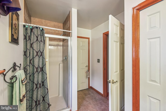 bathroom featuring tile patterned flooring and curtained shower