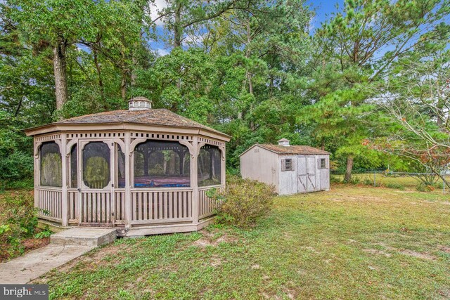 view of yard with a gazebo and a shed