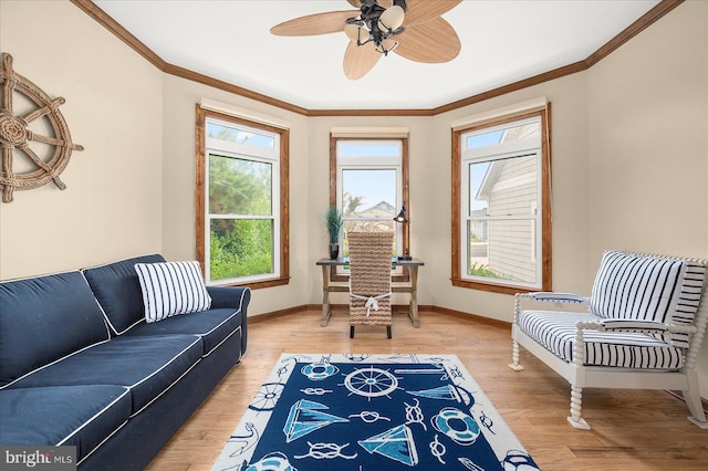 interior space featuring hardwood / wood-style floors, crown molding, and ceiling fan