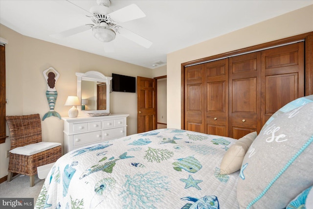 bedroom featuring a closet, carpet flooring, and ceiling fan