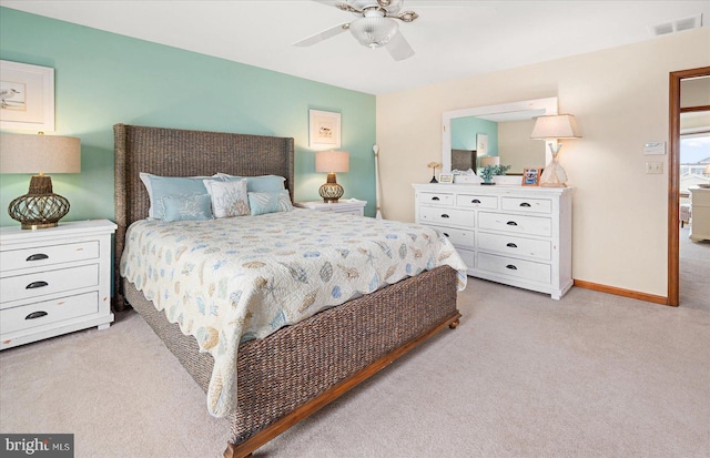 bedroom with light carpet and ceiling fan