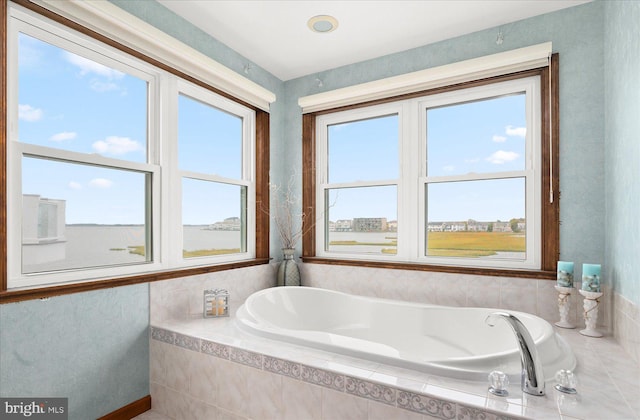 bathroom featuring tiled bath