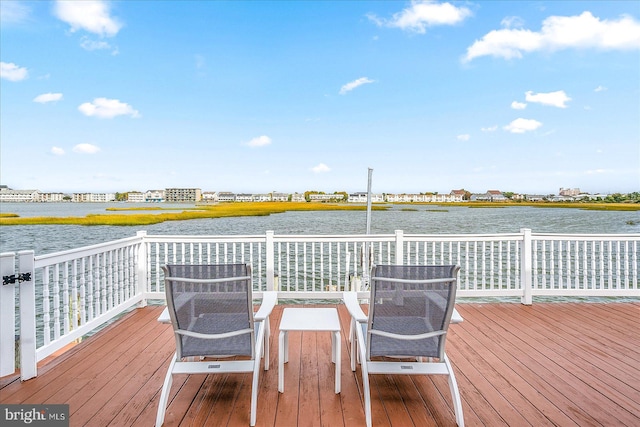 wooden deck with a water view