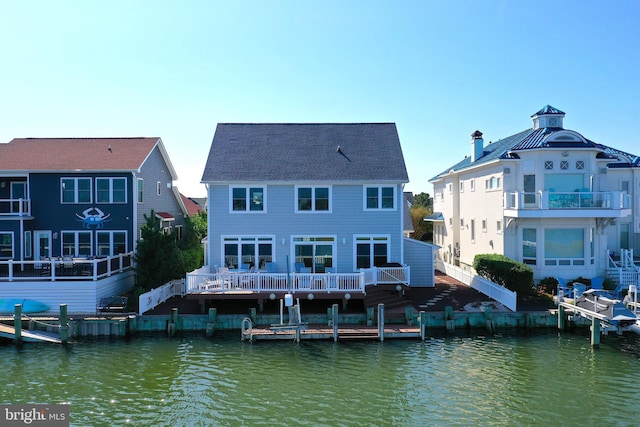 rear view of property featuring a water view